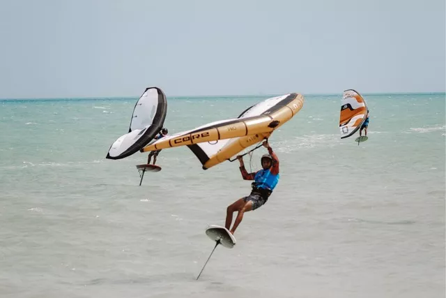 Wing Foiler riding on the water during a competition at Kite Fest Guajira in Mayapo.